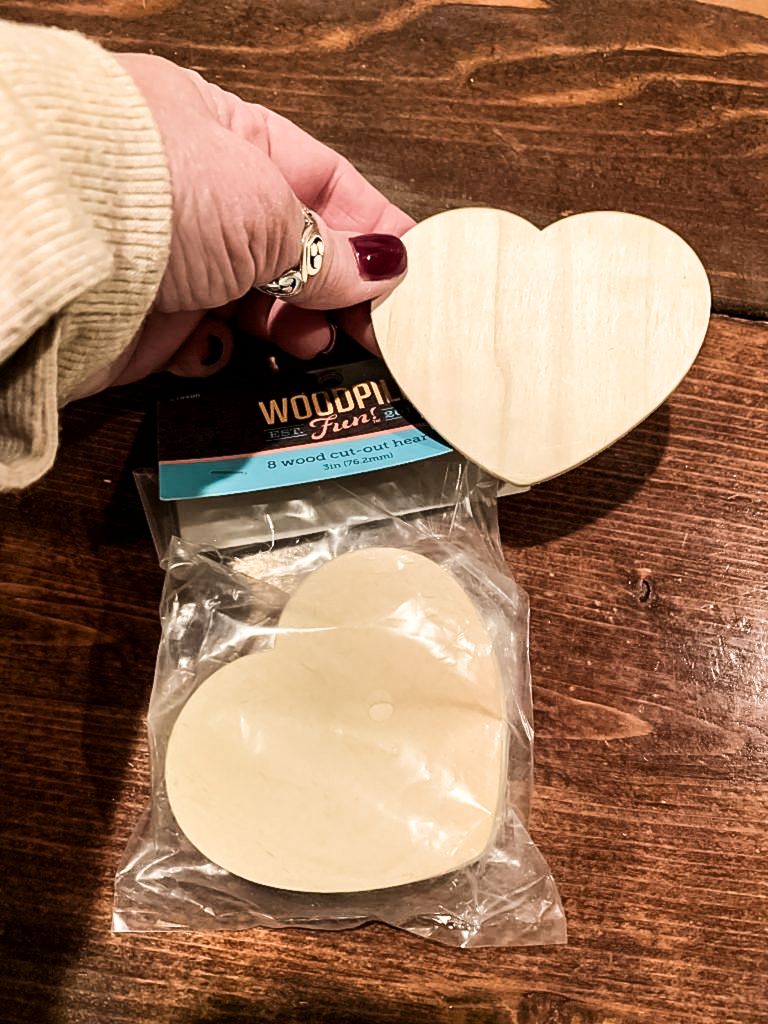 A package of 3 inch wooden hearts. 
