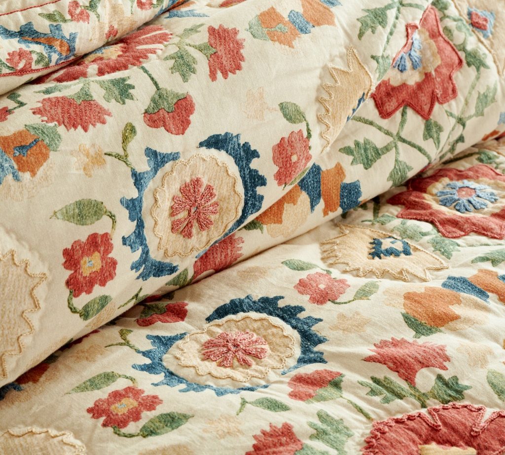 A patterned floral quilt from pottery barn. 