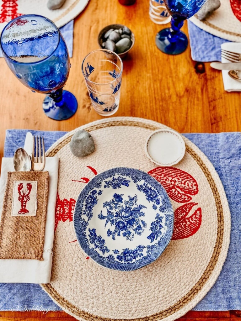 A lobster table theme set in red. white and blue. 