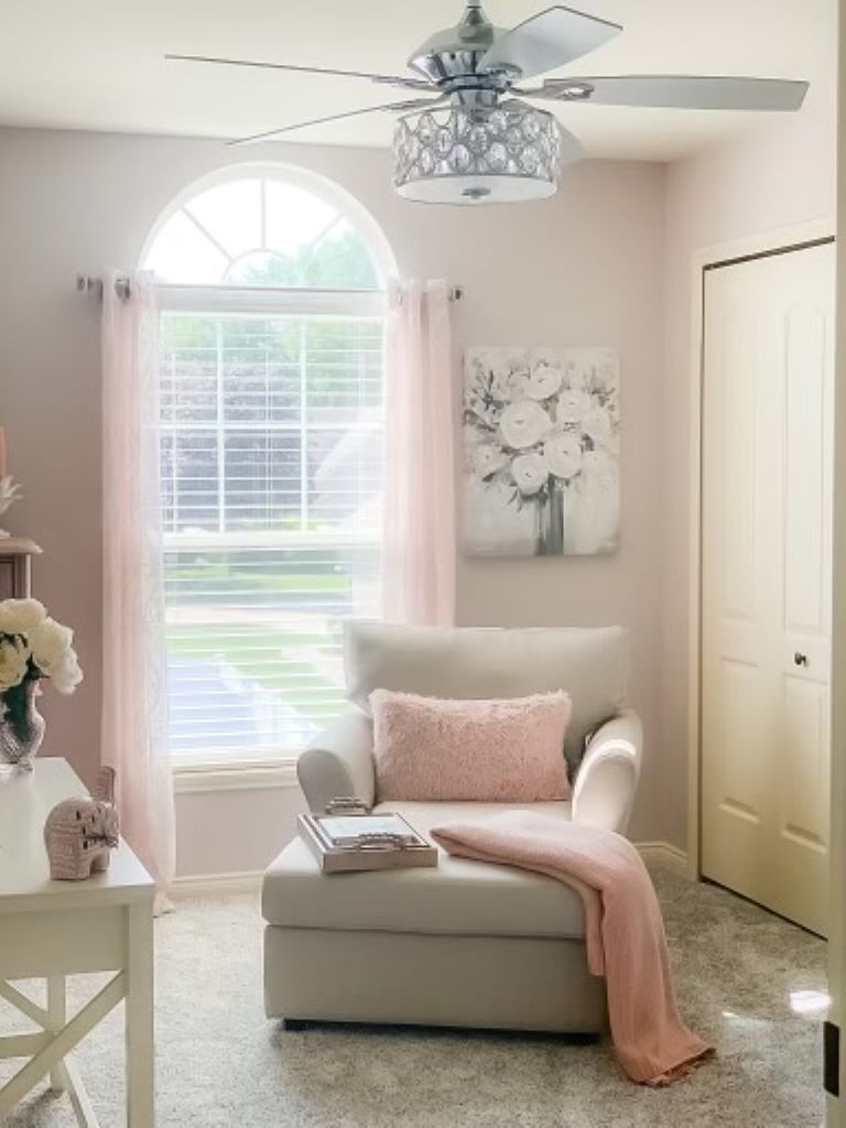 Cozy reading nook with a chaise lounge, armchair, and soft pink accents.