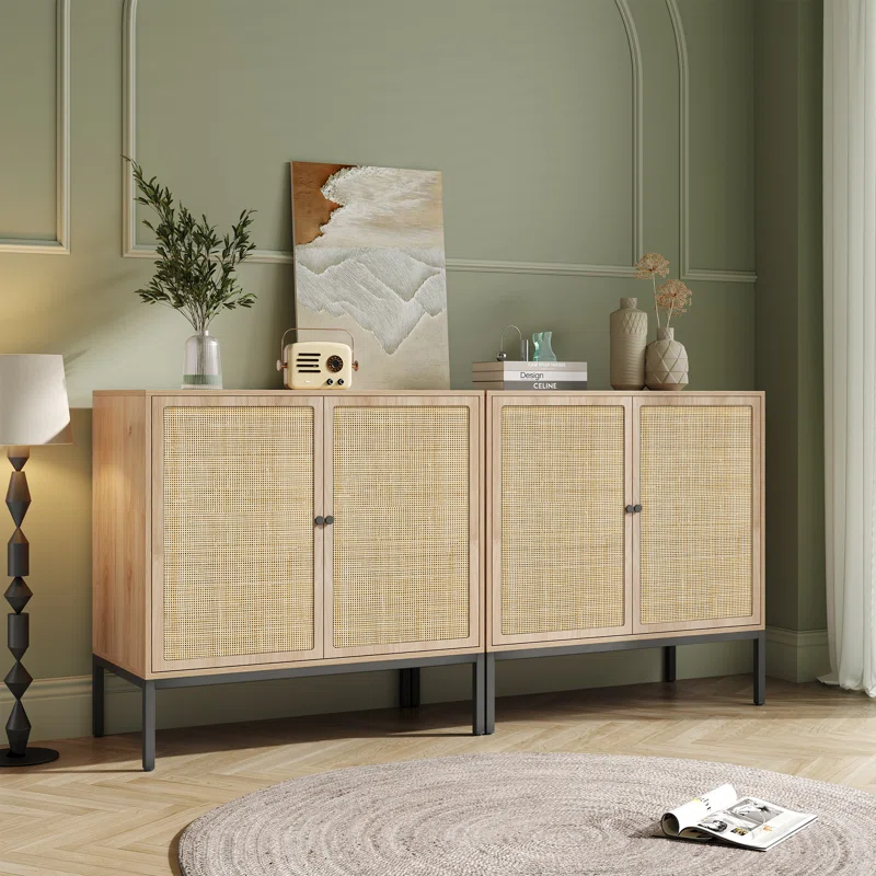 Two Acelynn 31.5-inch wide sideboards styled side-by-side to create a long credenza, featuring light wood frames, woven cane cabinet doors, and dark metal legs in a room with soft green walls.