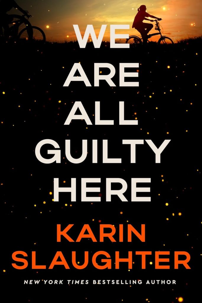 A book cover for We Are All Guilty Here by Karin Slaughter. The cover features a dark background sprinkled with golden, glowing spots that resemble fireflies or embers. At the top, silhouetted against a vibrant orange and yellow sunset, two people on bicycles are seen on a hillside. The book's title is prominently displayed in large white letters, with the author's name in bold orange letters below it.