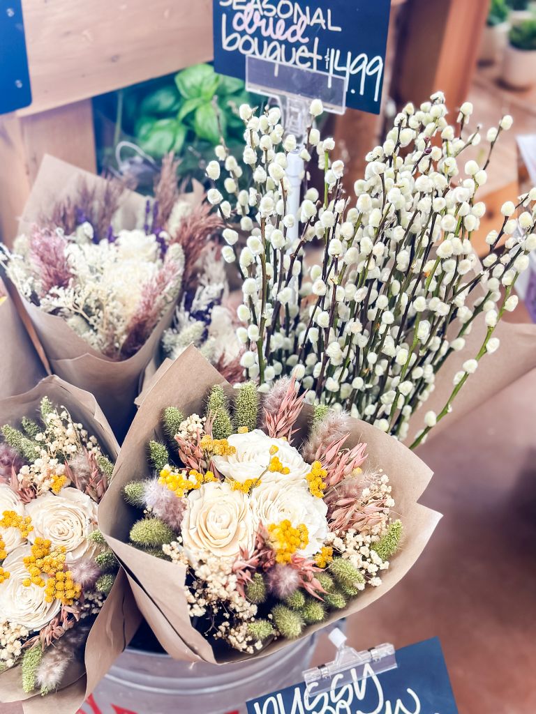 Pussy willows in a flower store with other seasonal dried bouquets. 