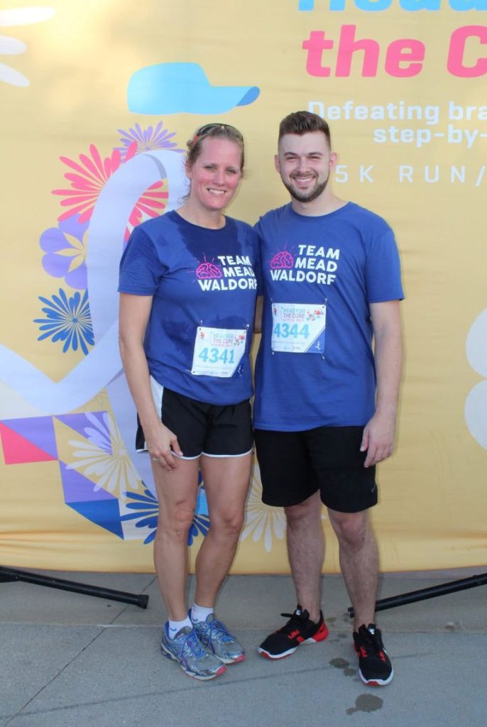 A picture of a man and women who have been running for Head for the Cure charity.