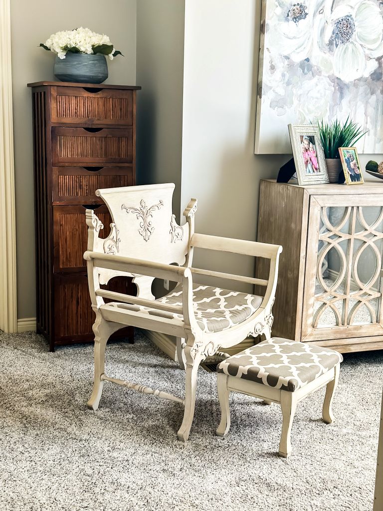 Repurposed vintage accent chair with matching footstool in a home office setting, illustrating how to decorate with what you already have.