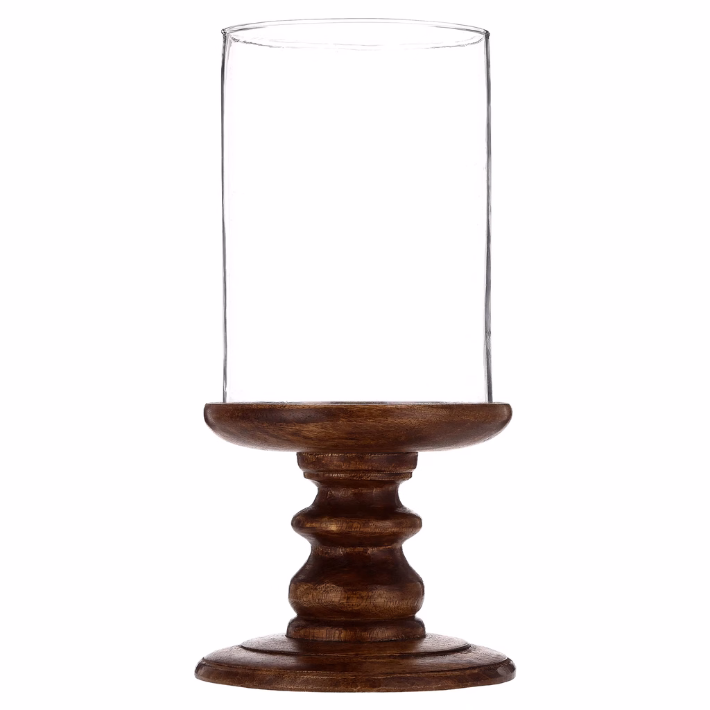 Carved dark wood candlestick base with clear glass hurricane cylinder for fall table setting.