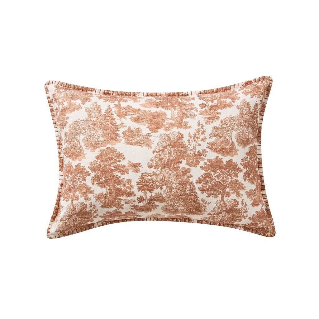 Vintage style rust terracotta toile lumbar throw pillow with forest pattern for fall decor.