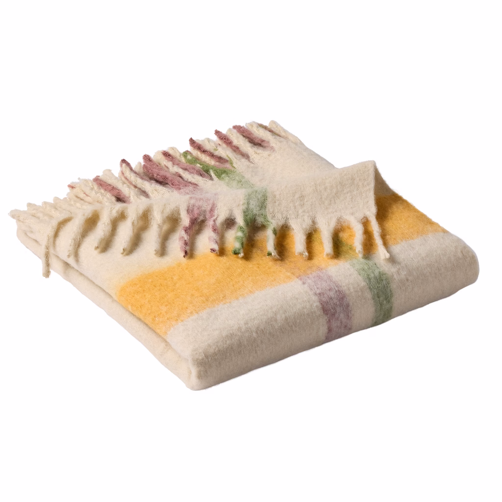 Cozy cream woven throw blanket with mustard yellow green and berry plaid stripes with fringe.