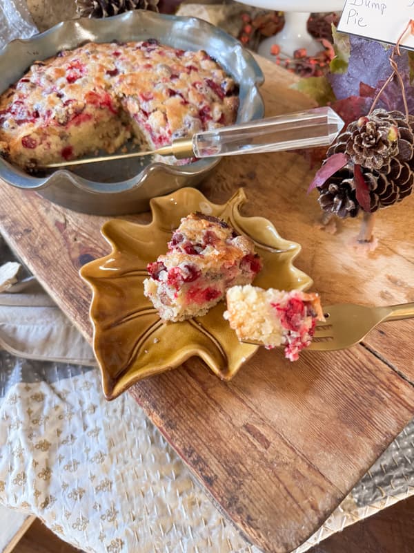 Warm cranberry dump pie with sweet pecans and tart fresh berries baked in a pie dish.